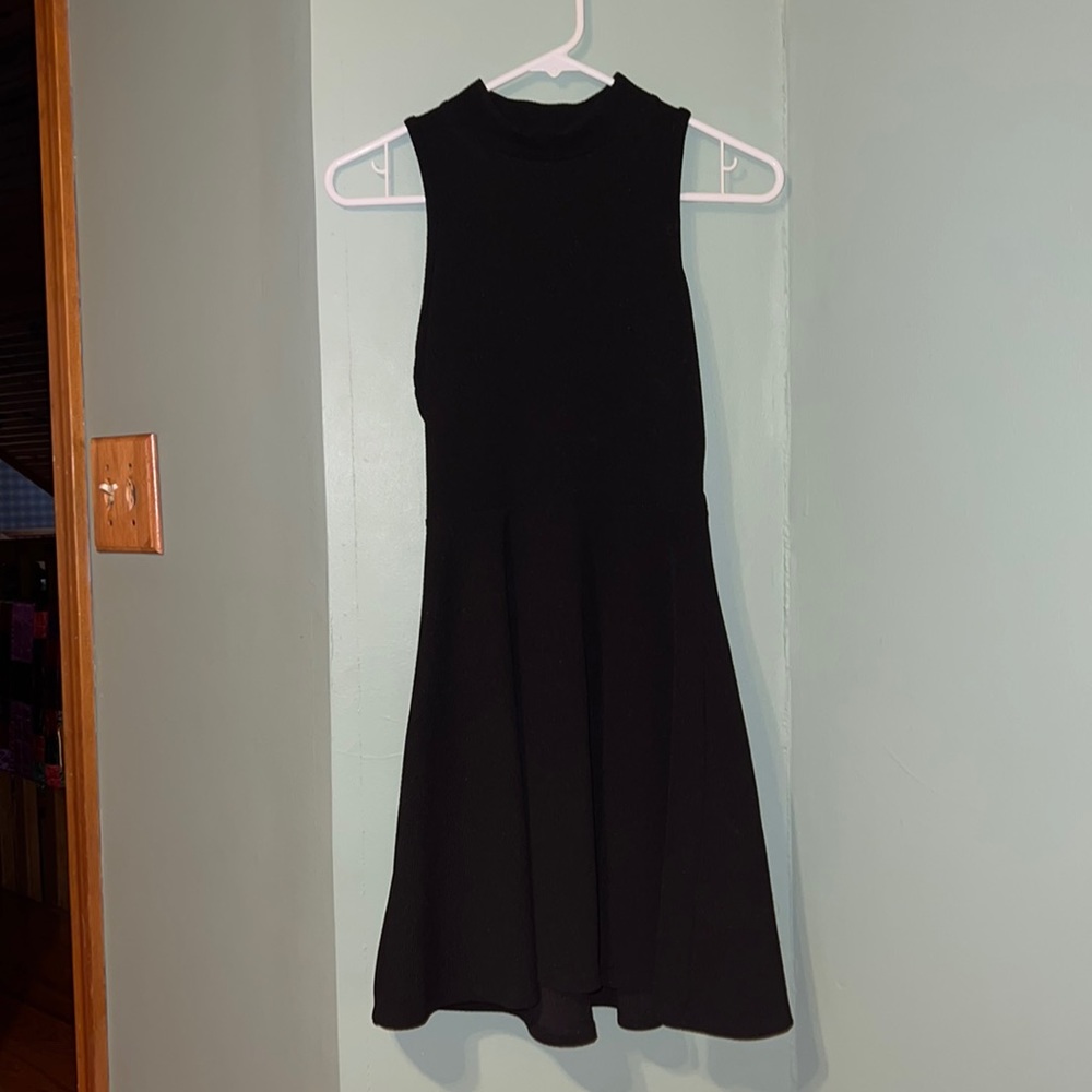 Little black dress with cut out on back. Like new.
